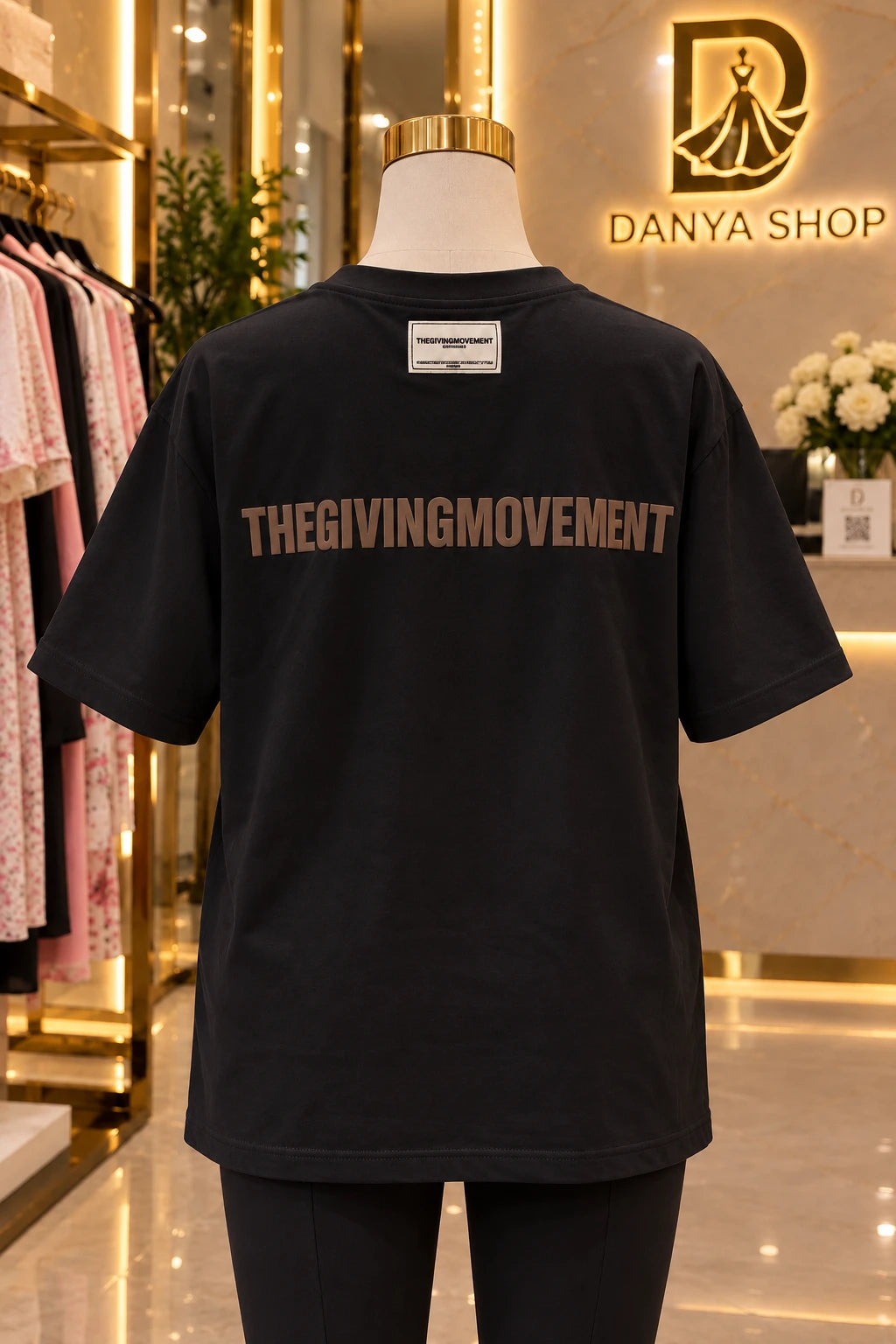 The Giving Movement – t-shirt noir, dos avec logo
